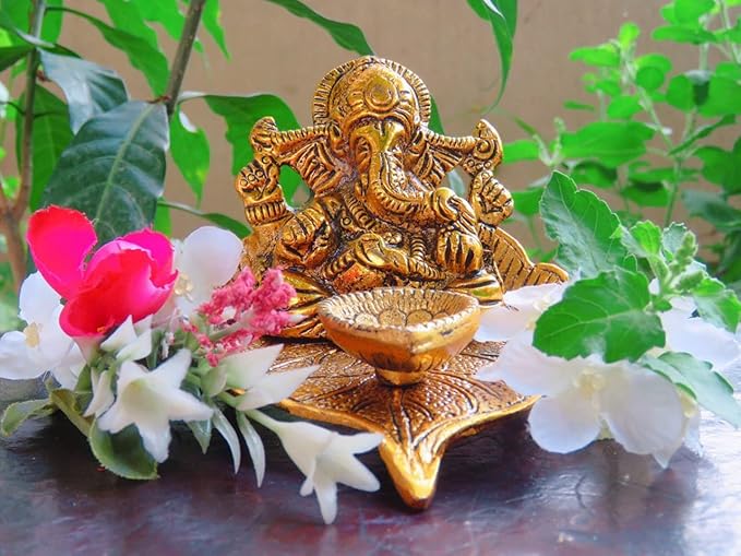 Image of Ganesha on Leaf with Diya – Handcrafted Metal Idol for Home